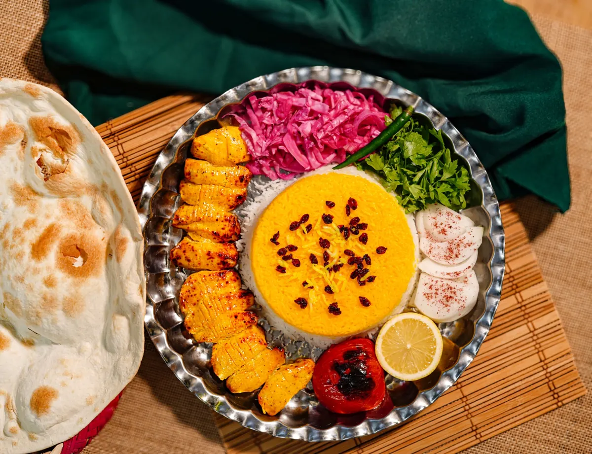 Saffron chicken platter with buttered basmati rice at Kabab Planet Muscat
