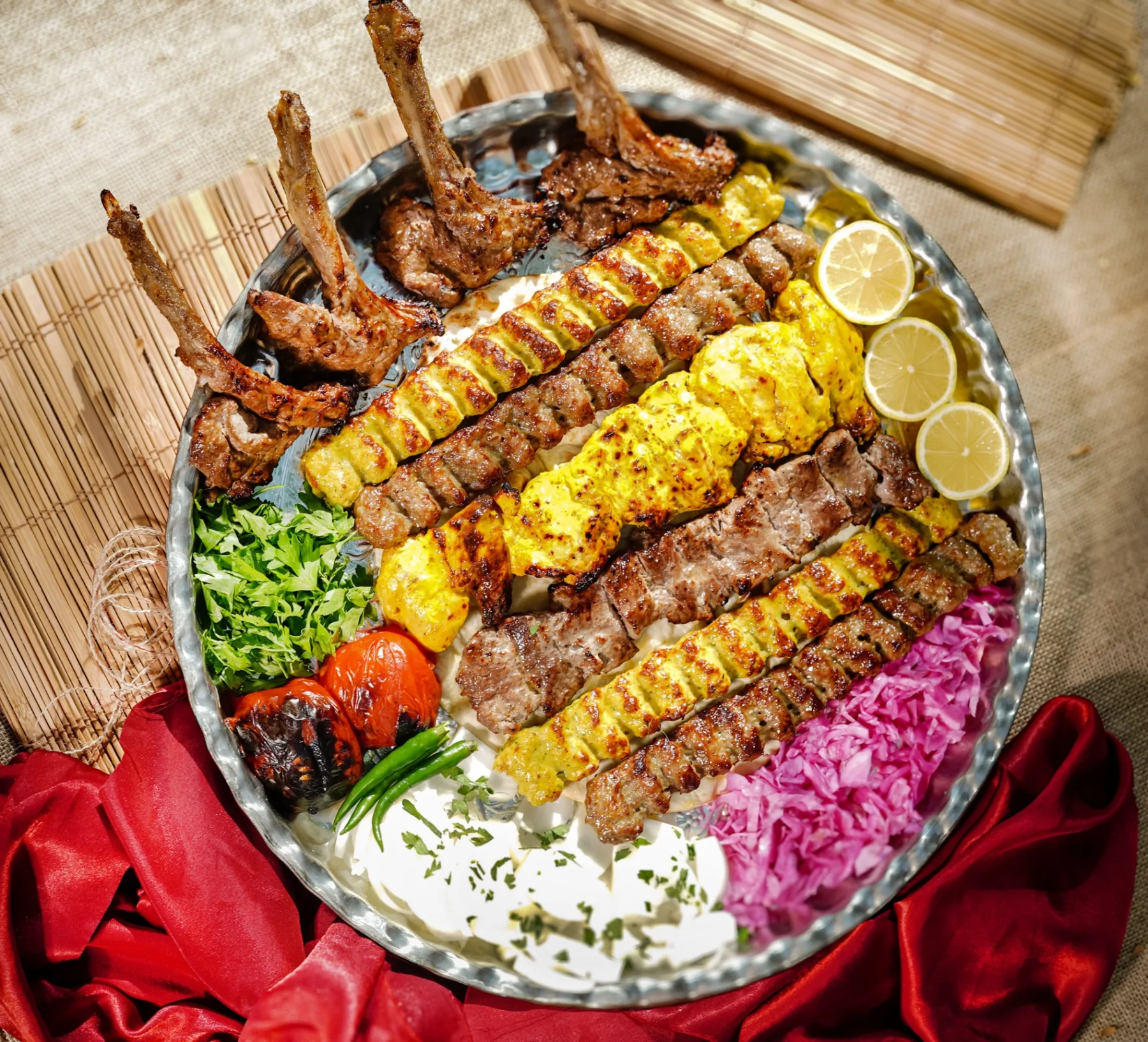 Royal Persian mixed grill — lamb chops, koobideh, jujeh and shish tawook over saffron rice